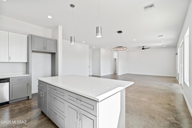 kitchen with gray cabinets, concrete flooring, decorative light fixtures, dishwasher, and a center island