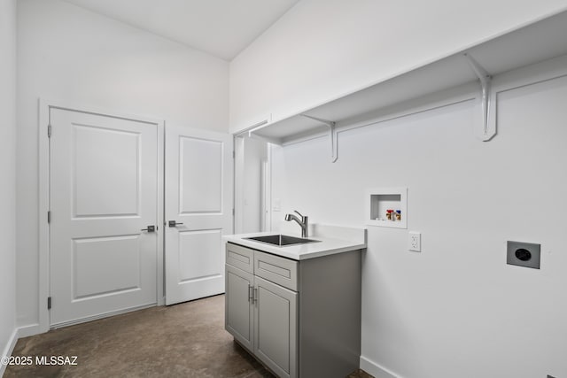 clothes washing area featuring cabinets, washer hookup, hookup for an electric dryer, and sink