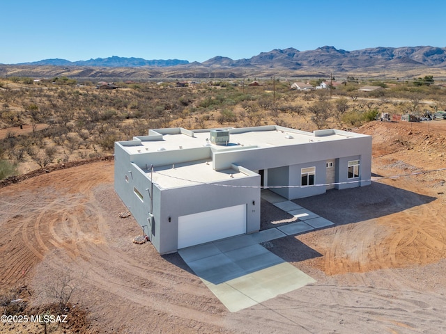 birds eye view of property with a mountain view