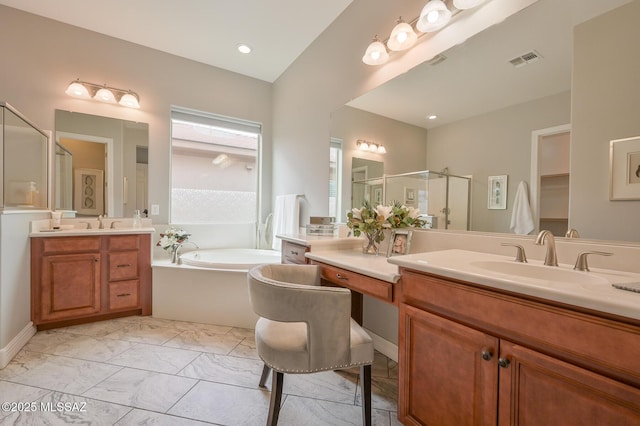 full bathroom with visible vents, a bath, a sink, a shower stall, and marble finish floor