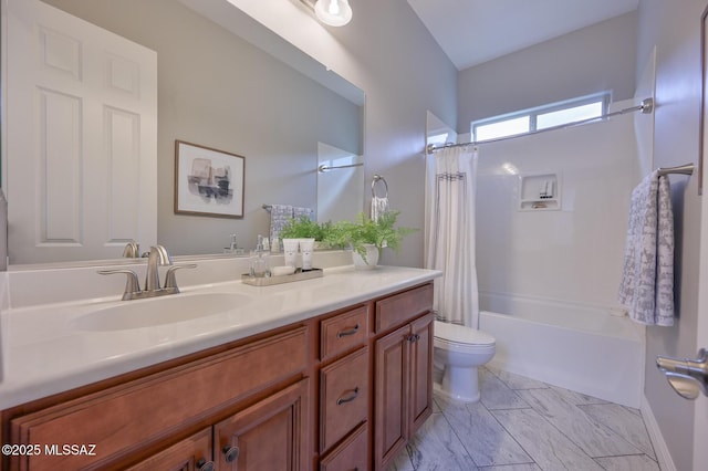 full bath featuring shower / tub combo with curtain, vanity, and toilet