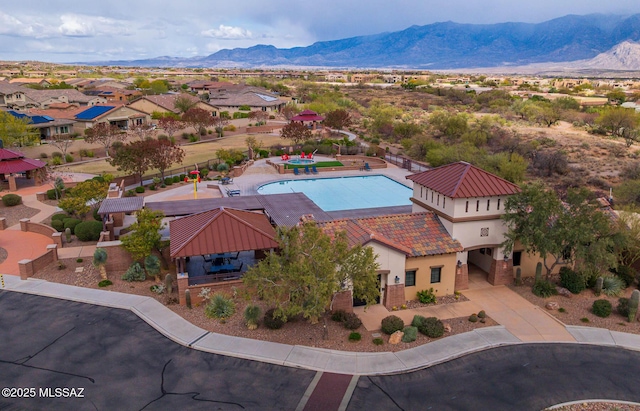 birds eye view of property featuring a mountain view
