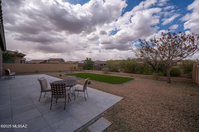view of patio / terrace featuring outdoor dining space and a fenced backyard