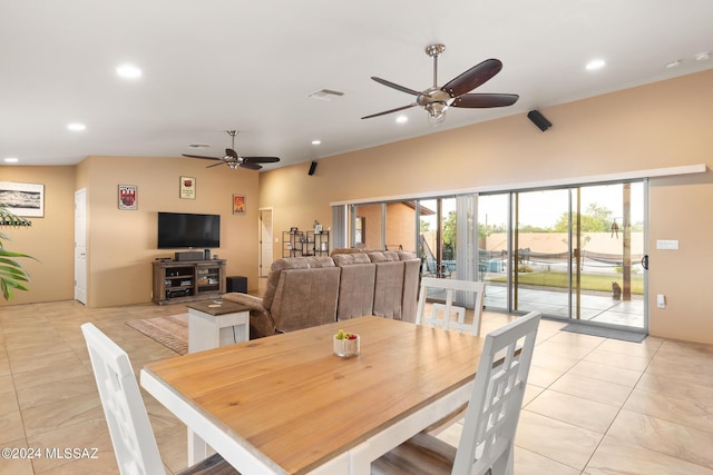 dining area with light tile patterned floors and ceiling fan