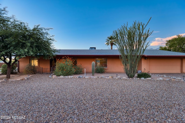 ranch-style home with a garage