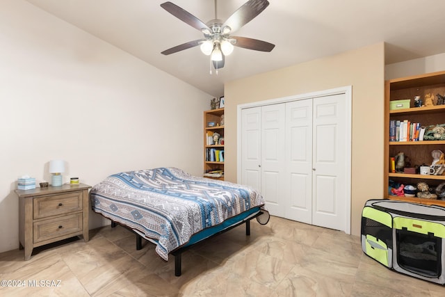 bedroom with ceiling fan and a closet