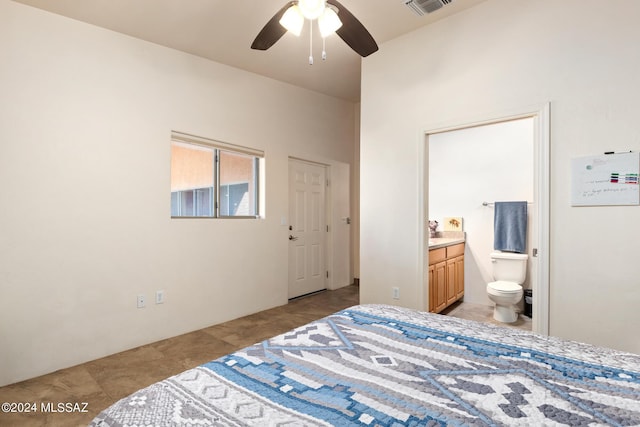 bedroom with ceiling fan and ensuite bath