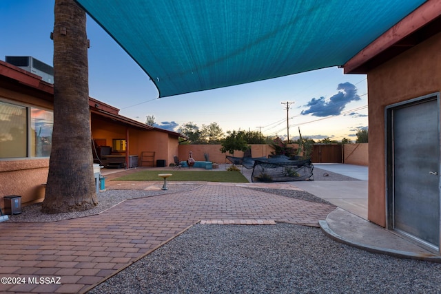 view of patio terrace at dusk