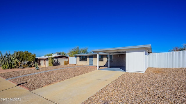 single story home featuring a carport