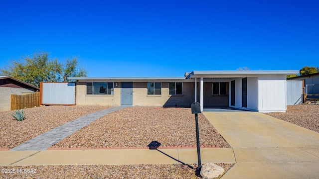 single story home with a carport