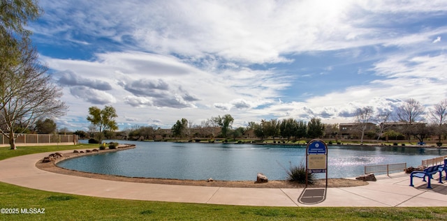 view of swimming pool with a water view