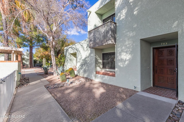 entrance to property with a balcony