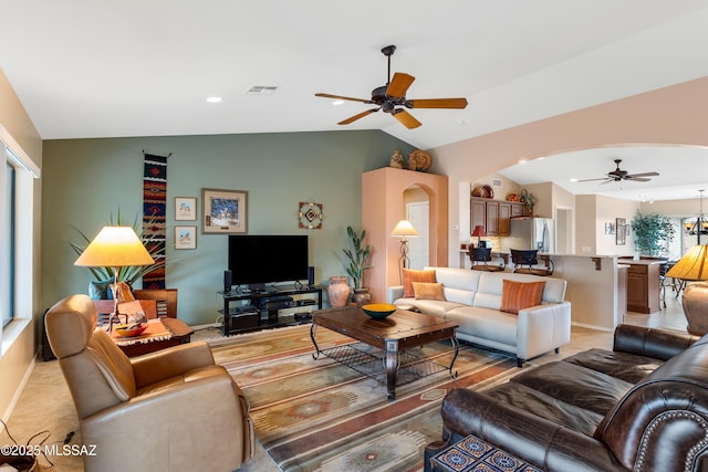 living room featuring lofted ceiling and ceiling fan