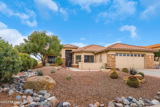 mediterranean / spanish-style house featuring a garage