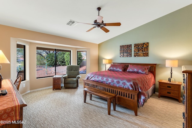 bedroom featuring light carpet, vaulted ceiling, and ceiling fan