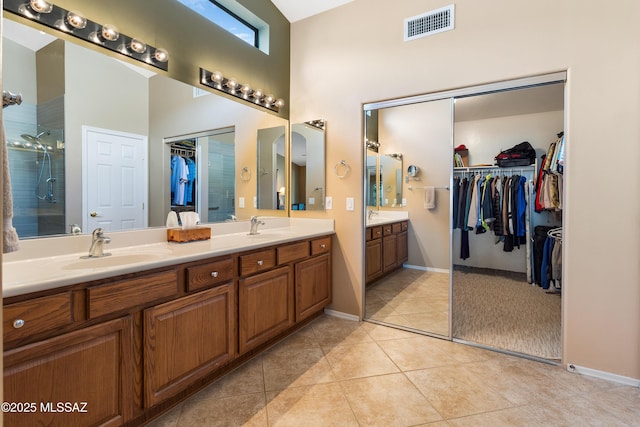 bathroom with tile patterned flooring and vanity