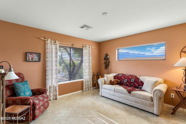 living room with light tile patterned floors