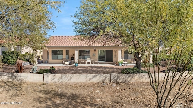 rear view of house featuring a patio area