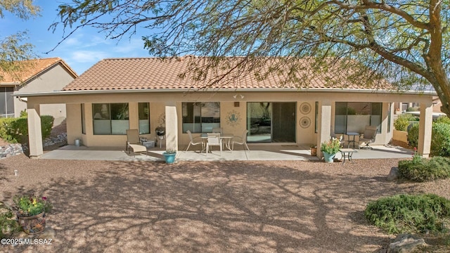 back of property featuring a patio area