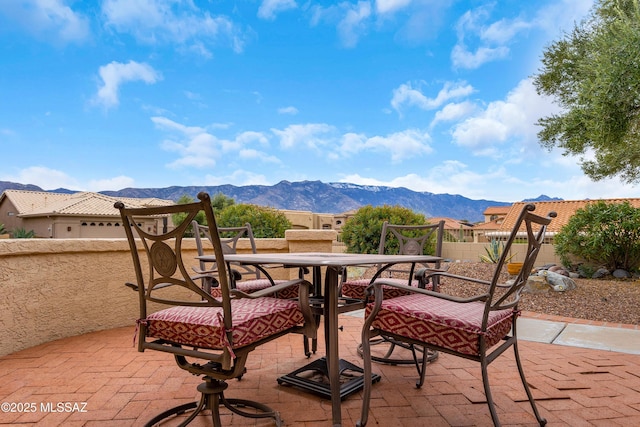 view of patio / terrace featuring a mountain view