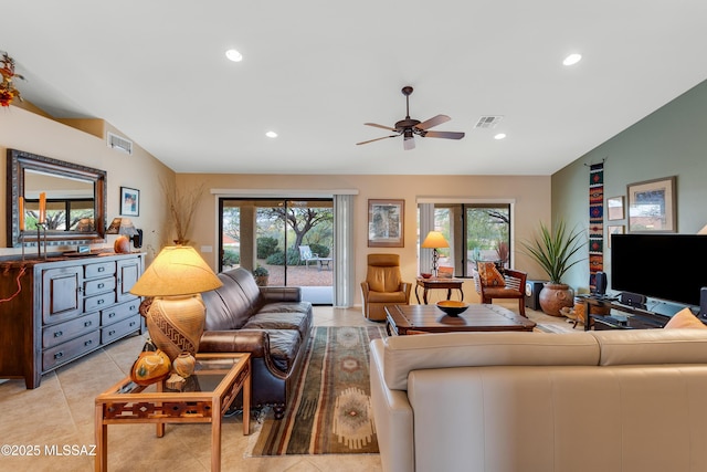 tiled living room featuring ceiling fan