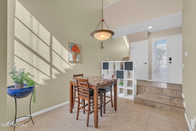 dining space with light tile patterned flooring