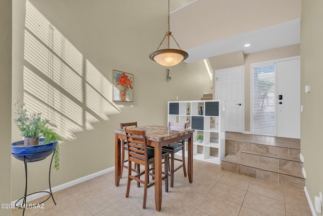 dining area featuring light tile patterned floors