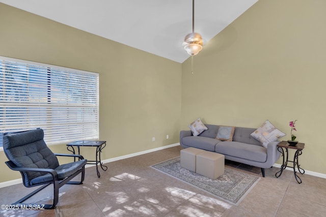 living room with tile patterned flooring and vaulted ceiling