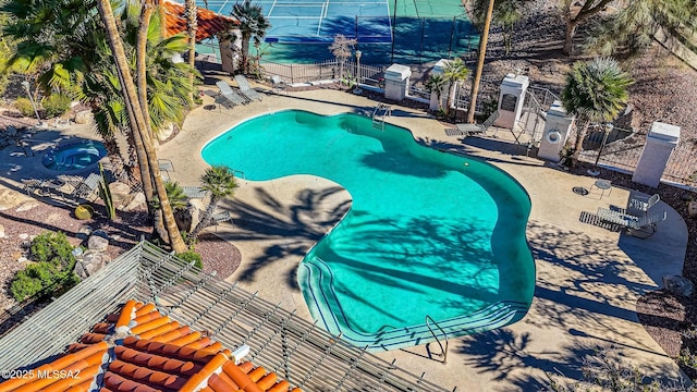 view of swimming pool with a patio area and a hot tub