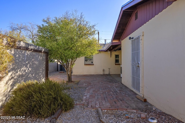 view of property exterior with a patio