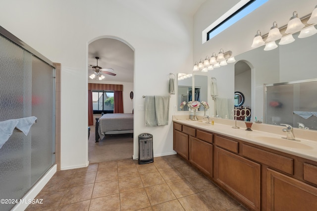 bathroom with a sink, a shower stall, ensuite bath, and tile patterned floors