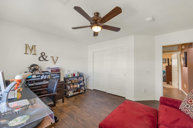 office featuring ceiling fan, dark wood-style flooring, and baseboards