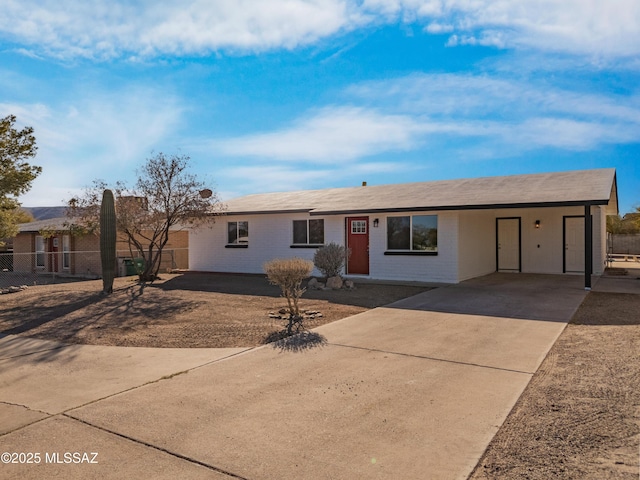 ranch-style home with a carport