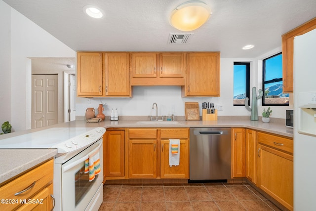 kitchen featuring tile patterned floors, sink, white electric stove, dishwasher, and kitchen peninsula