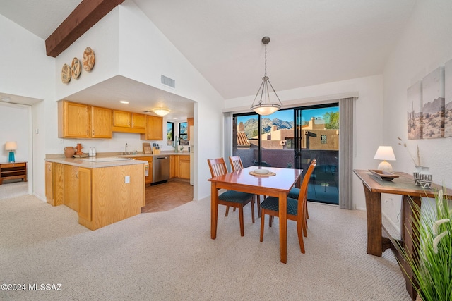 dining room featuring light colored carpet, high vaulted ceiling, beam ceiling, and sink