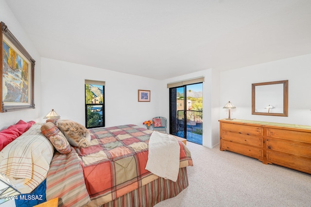 bedroom featuring carpet and access to outside