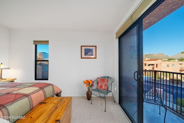 carpeted bedroom featuring access to exterior