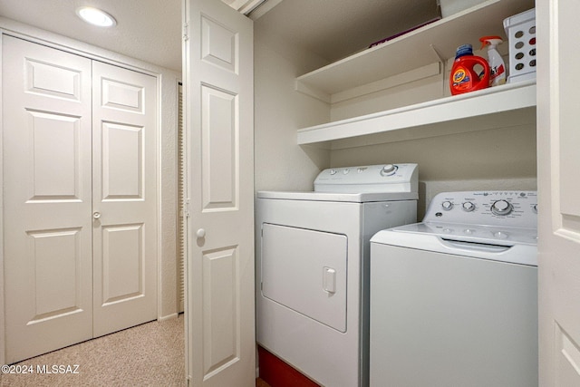 laundry room with washing machine and dryer