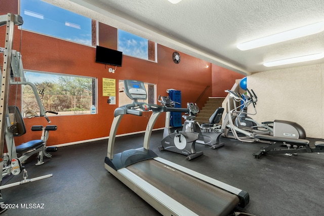 exercise room with a textured ceiling