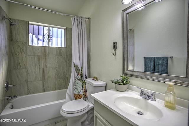 bathroom with toilet, shower / bath combo with shower curtain, vanity, and a textured wall