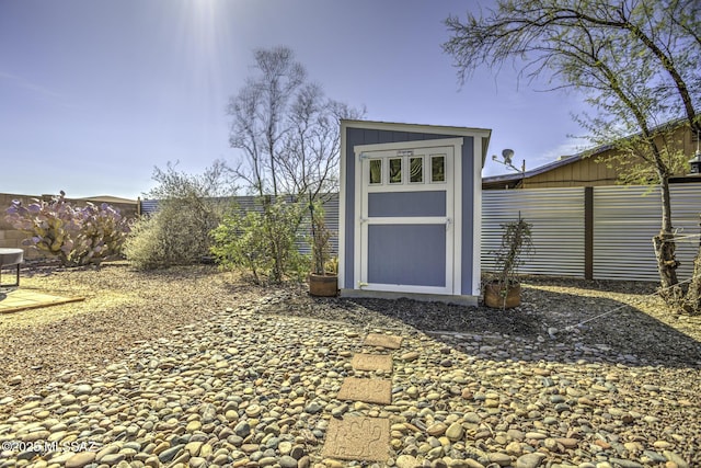 view of shed with a fenced backyard