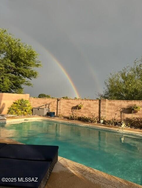 view of pool featuring a fenced in pool and a fenced backyard