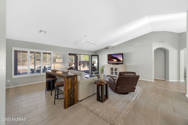 living room featuring lofted ceiling and ceiling fan