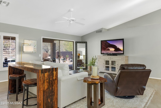 living room with ceiling fan and vaulted ceiling