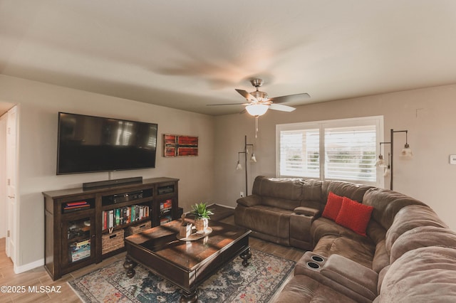 living room with hardwood / wood-style floors and ceiling fan