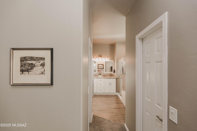 corridor featuring light hardwood / wood-style floors