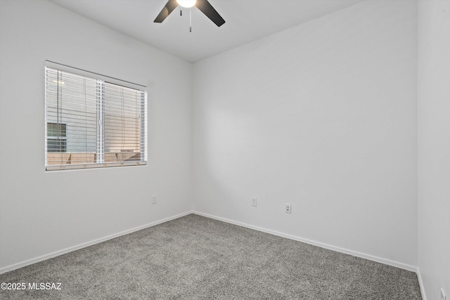 unfurnished room with ceiling fan and carpet flooring