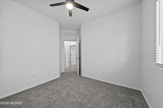 carpeted empty room with ceiling fan