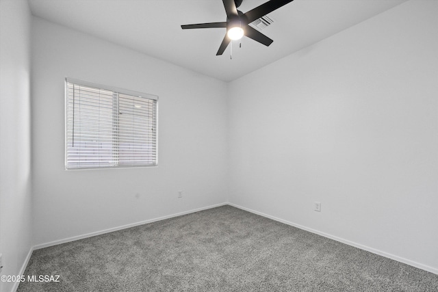 carpeted empty room featuring ceiling fan