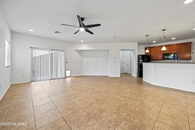 unfurnished living room with light tile patterned floors and ceiling fan